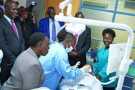 Prof. Elizabeth Dimba demonstrates how the dental chair is operated.